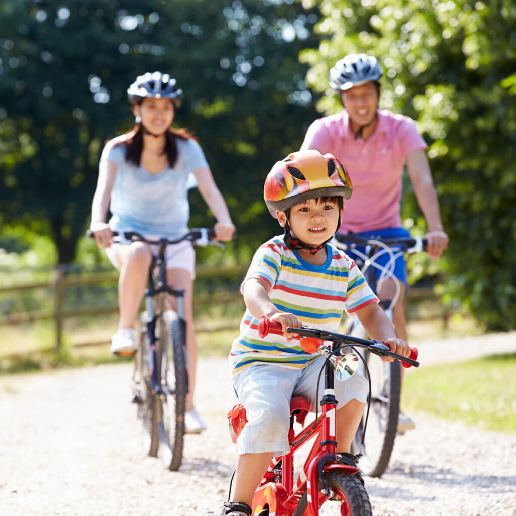 Asian Family on a bike ride