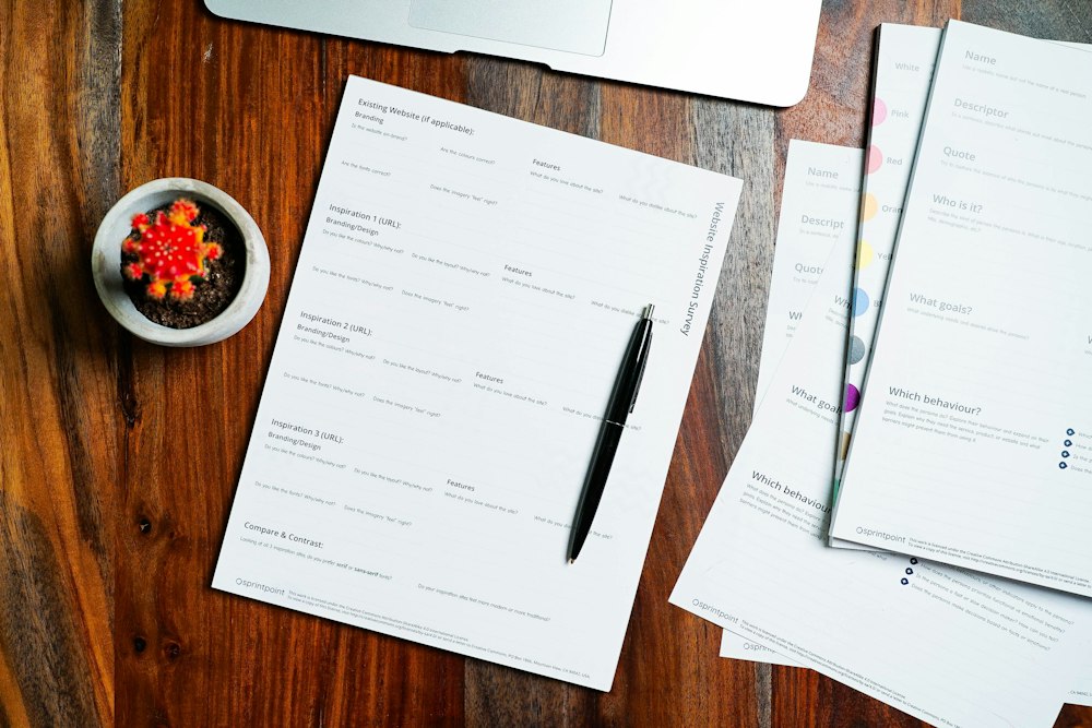 Legal papers and a pen on a wooden desk
