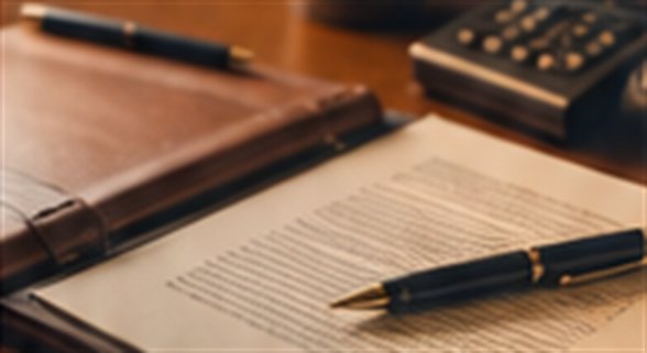 Legal documents and a pen on a desk